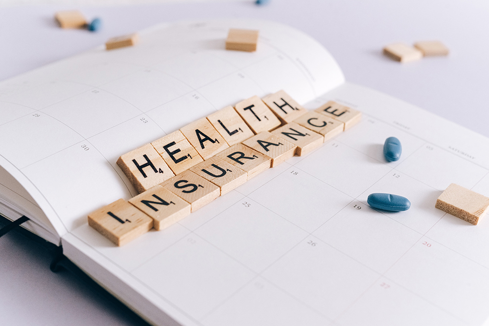 Health-Insurance-Scrabble-Tiles-on-Planner
